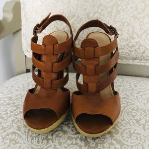 Tan, strappy, high-heel sandals.
